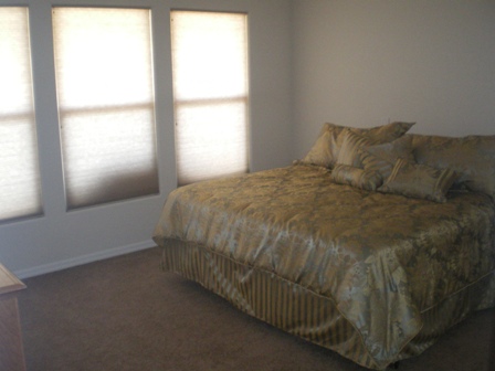Master bedroom with large windows 